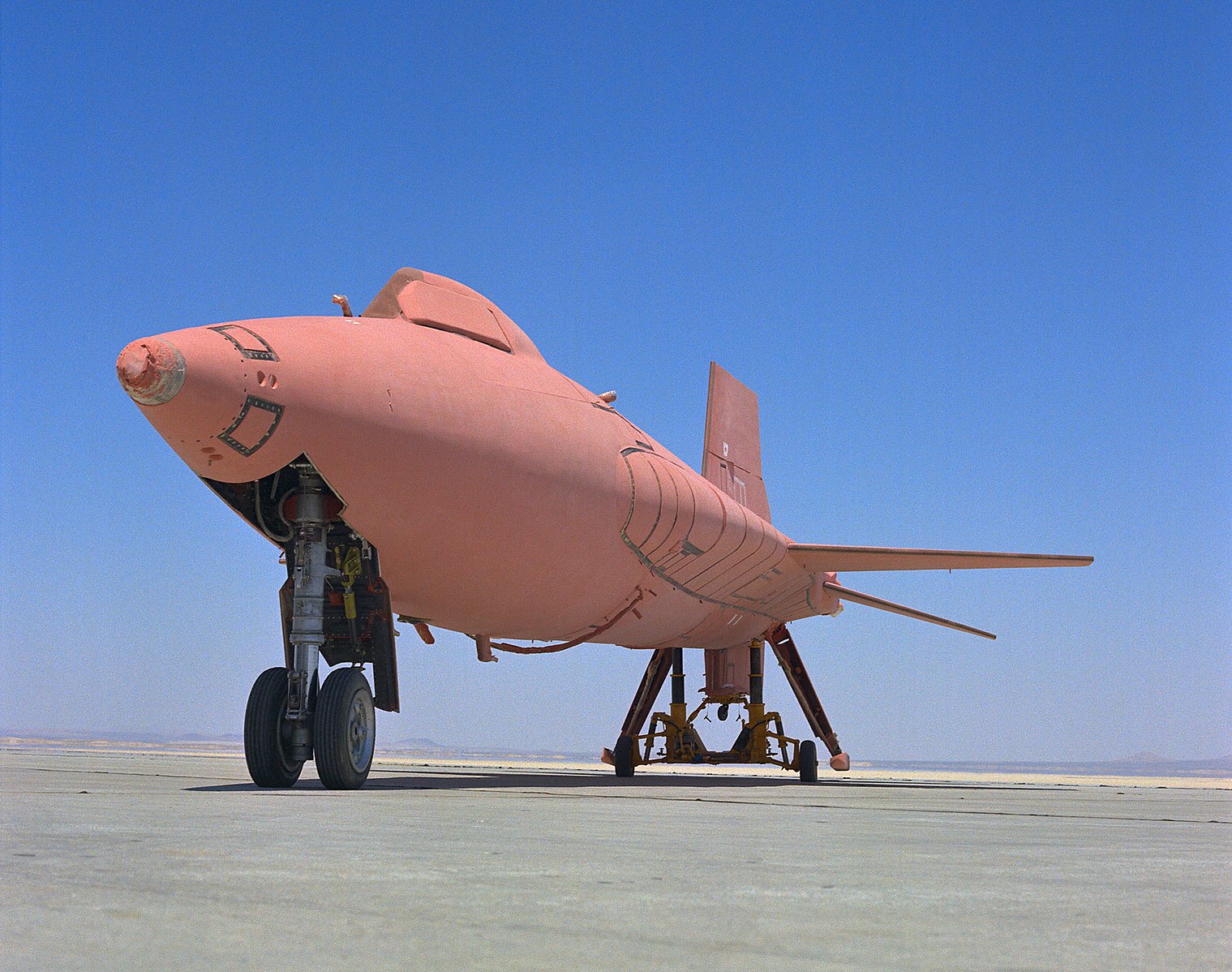 An aircraft with a pink ablative barrier coating.