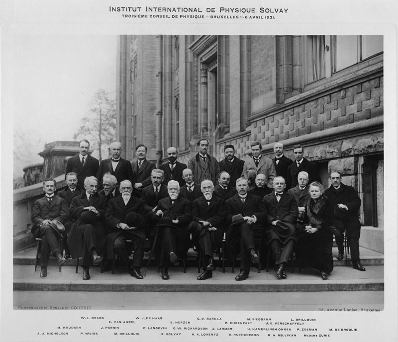A black-and-white photograph of the scientists in attendance at the Third Solvay Conference on Physics, where Larmor is fifth from left in the middle row.