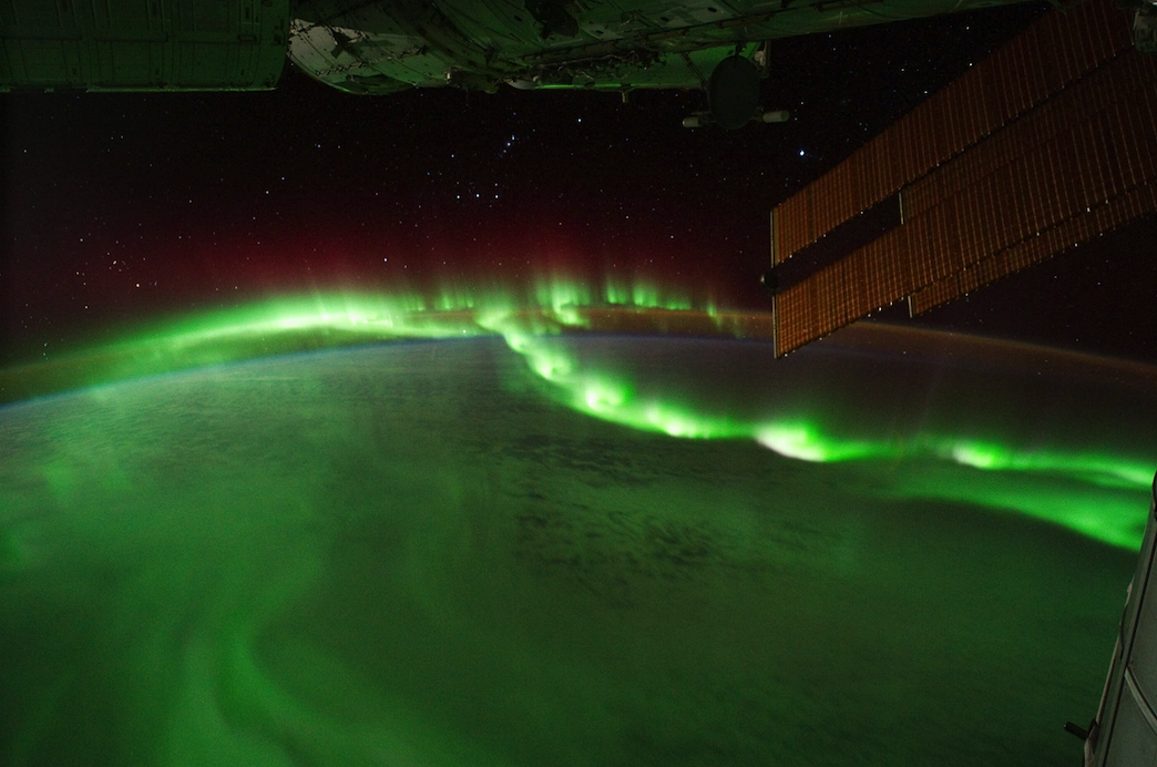 A wide shot of the glowing aurora borealis.