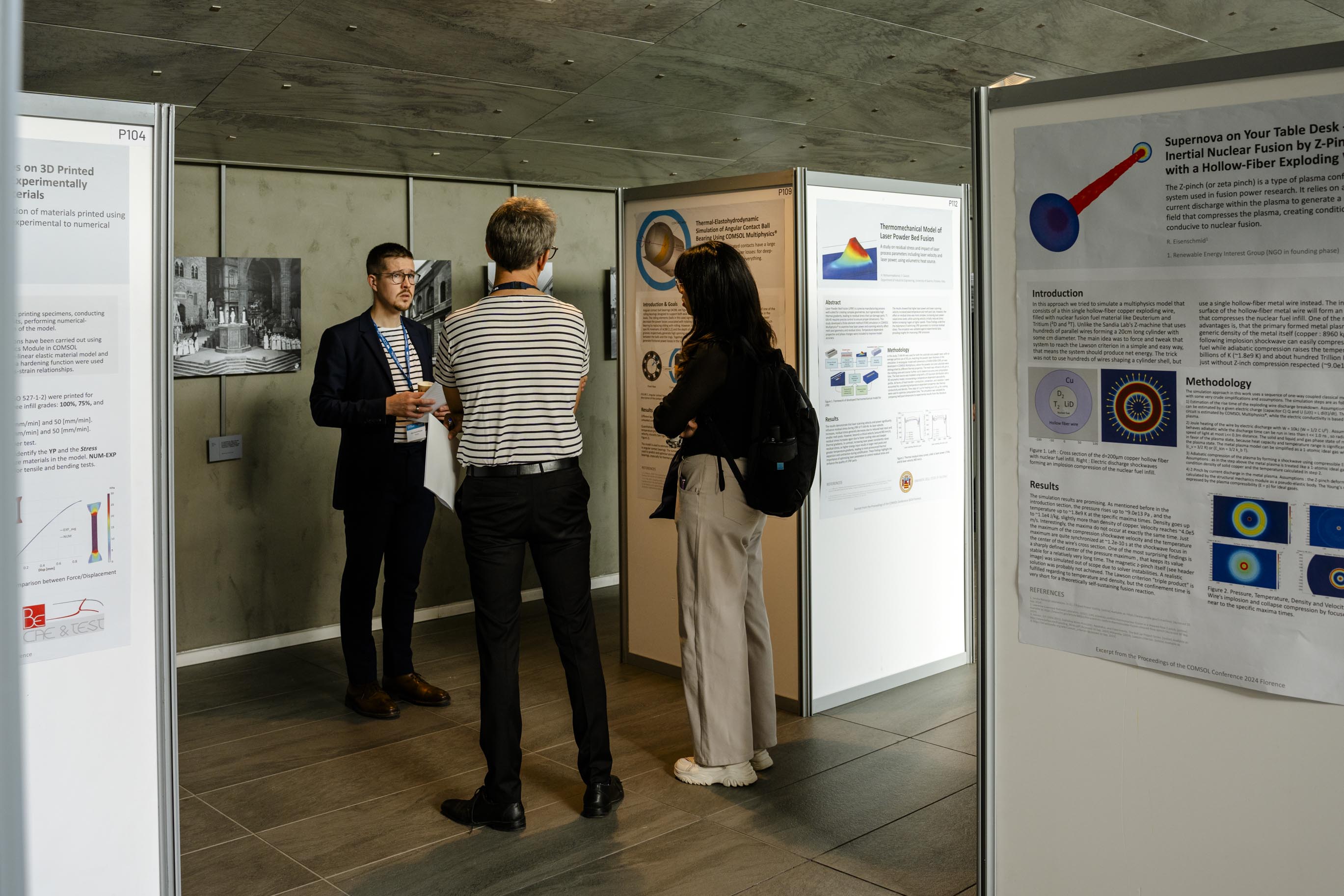 Conference attendees connecting in the poster hall. 