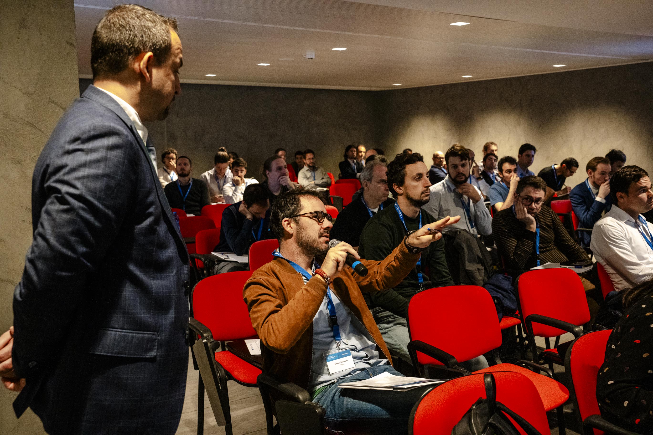 An attendee asking a question during a minicourse.