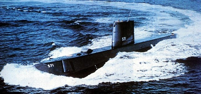 A photo of the USS Nautilus creating waves in the ocean.